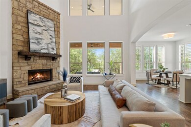 Living area with a stone fireplace and wood finis