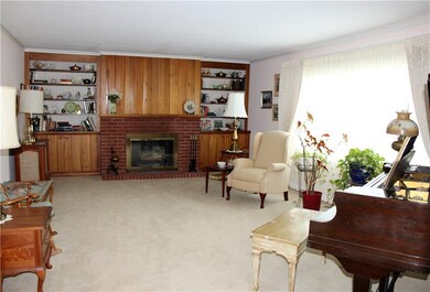 Large Formal Living Room with Fireplace and Built-