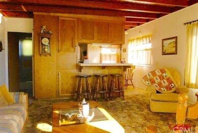 Warm knotty pine ceiling in living area and throug