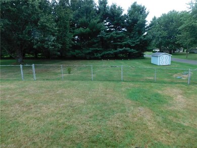 Large half acre lot with a shed.