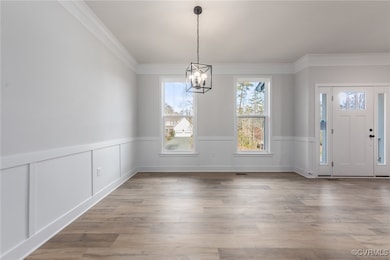 Unfurnished dining area featuring ornamental moldi