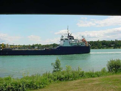 PORCH VIEWING FREIGHTER ON THE RIVER