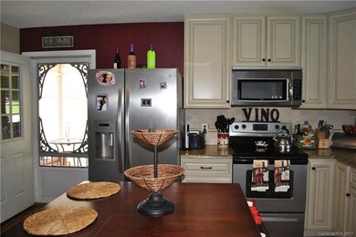 Kitchen view of carport/entertaining entry