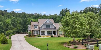 Experience the rare opportunity to own a truly extraordinary estate nestled on 2 private, park-like acres with stunning frontage on the serene Sharp Mountain Creek.