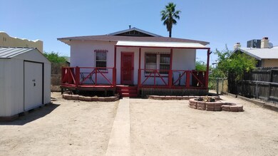 Back of home with deck...