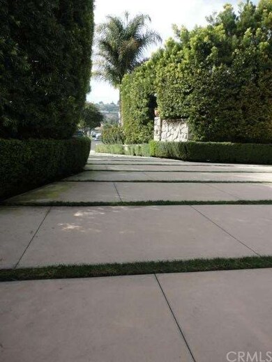 Private driveway off of the street to the 3 car ga