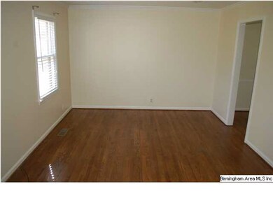 Living Room, also with beautiful hardwood floors.
