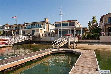 Looking from the water to dock and back of home