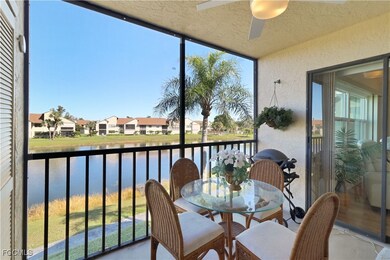 Balcony featuring ceiling fan and a water view