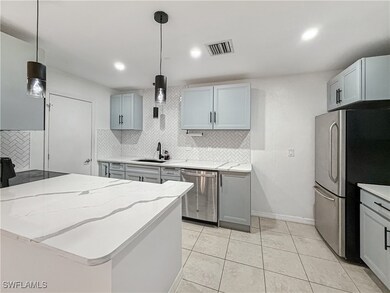 Kitchen with appliances with stainless steel finis