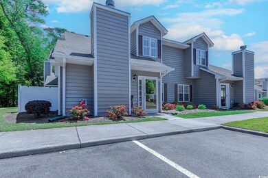 View of front of home with a shingled roof, fence,