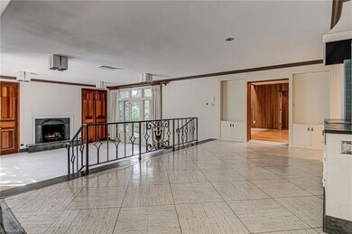 Sitting room overlooking sunken living room