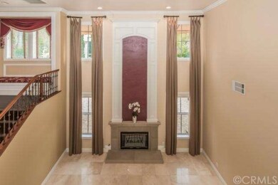 Opulent FORMAL LIVING ROOM with grand fireplace an