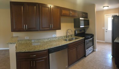 69 Sparrow Rd, Carpentersville, IL 60110 - photo 2