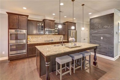 Gourmet kitchen!  Double ovens, gas range, large island with seating