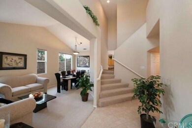 Family Room, Formal Dining and Dual Stairwell Lead