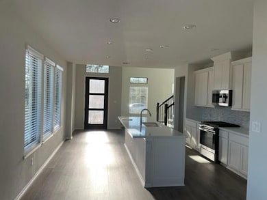 Kitchen featuring appliances with stainless steel