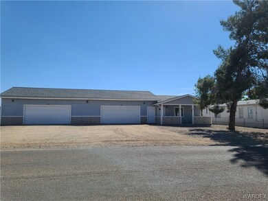 Ranch-style house with garages