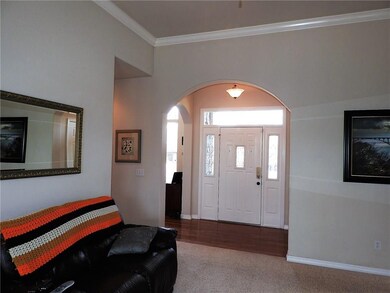 Looking toward the foyer open and bright. Hard wood entry and dining. 11 ft ceilings.
