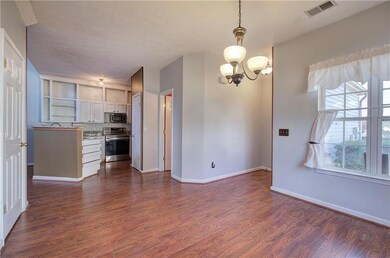 Dining room with a chandelier and LVP floors