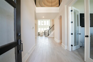 Check out the amazing entryway. Massive ceilings that will wow any guest.