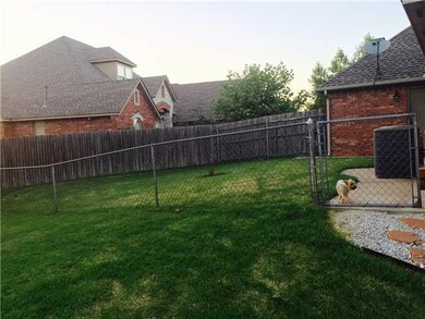 Exterior Back. Fenced in Dog run.