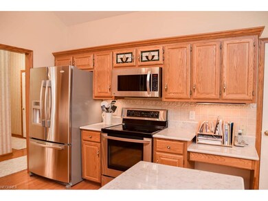 The kitchen has stainless steel appliances.