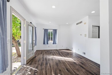 Entrance foyer with recessed lighting and dark wood-type flooring