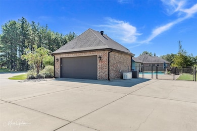 View of property exterior featuring a garage and c