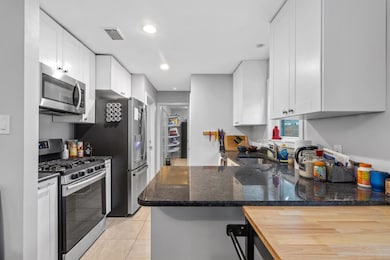 Kitchen featuring stainless steel appliances, a s
