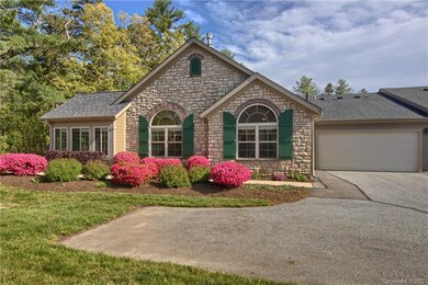 Side view of home with woods on left/front of home