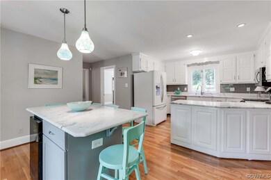 Kitchen featuring a kitchen bar, natural light, a