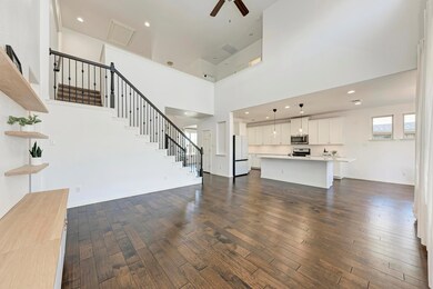 Unfurnished living room featuring ceiling fan, da