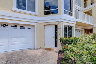 Entrance to property with an attached garage and s