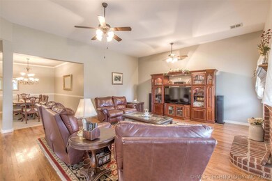 Open living, view into formal dining, extensive ha