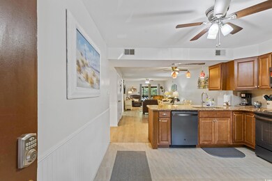 Kitchen featuring electric range, a sink, a ceiling fan, a peninsula, and stainless steel dishwasher