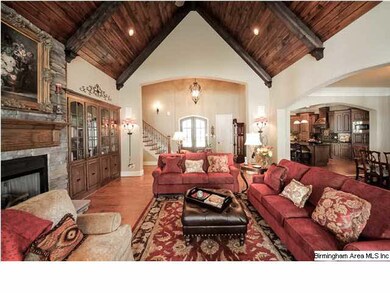 The great room features oak flooring, built in cab