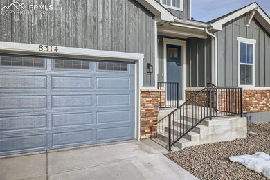 Entrance to property featuring a garage
