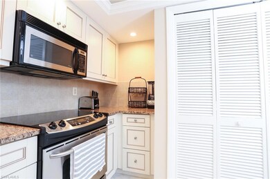 Kitchen with stainless steel appliances, white cab