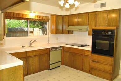 Kitchen has newer built in cook top and oven, tile