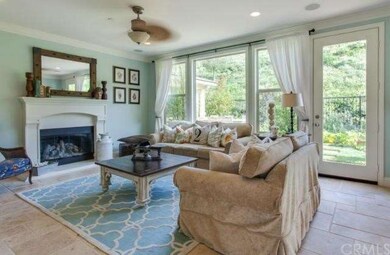 Spacious family room that looks out onto lush gard