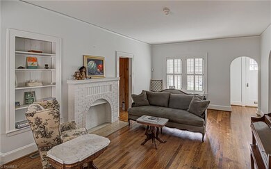 Check out the charming arched entry into the living room.
