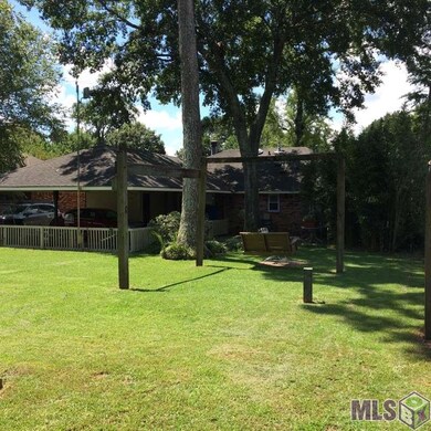 Double Carport, small patio, new chain link fence.