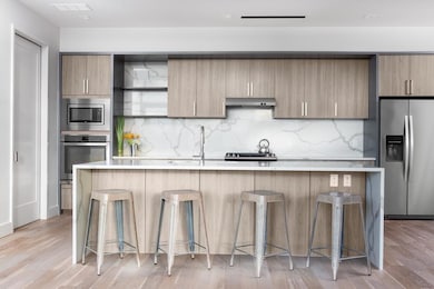 Kitchen with stainless steel appliances, under ca