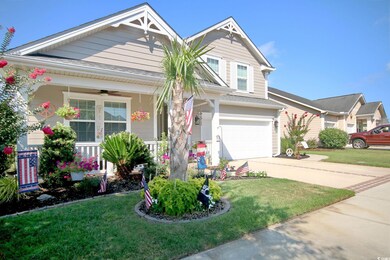 View of front of property with a garage, ceiling f