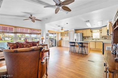 Open concept living room with view of the kitchen