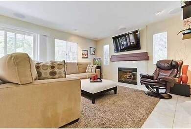 SPACIOUS FAMILY ROOM SITS OFF THE LARGE OPEN KITCH