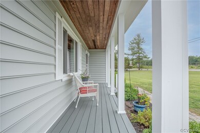 Sweet and inviting covered front porch.