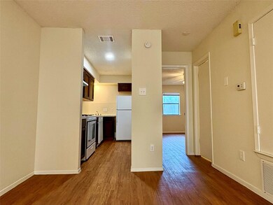 Kitchen with stainless steel gas stove, light cou