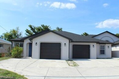 Ranch-style home featuring a garage, driveway, and
